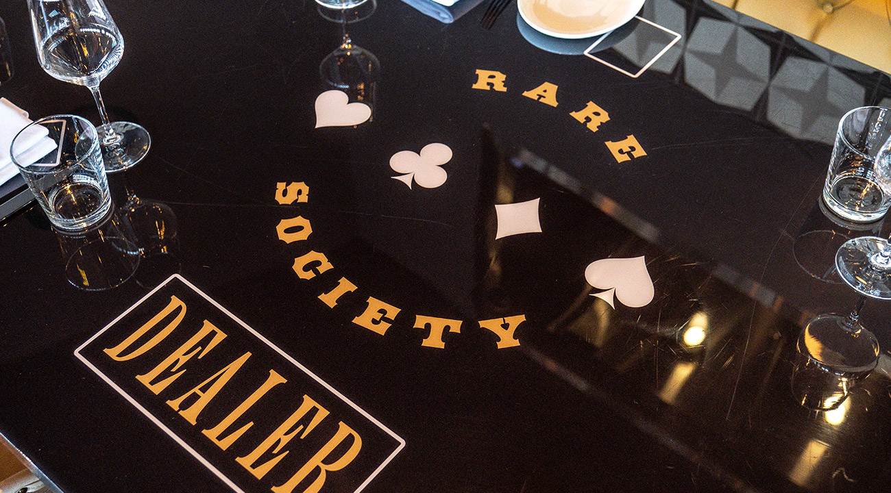 Rare Society poker themed dealer dining table with glassware